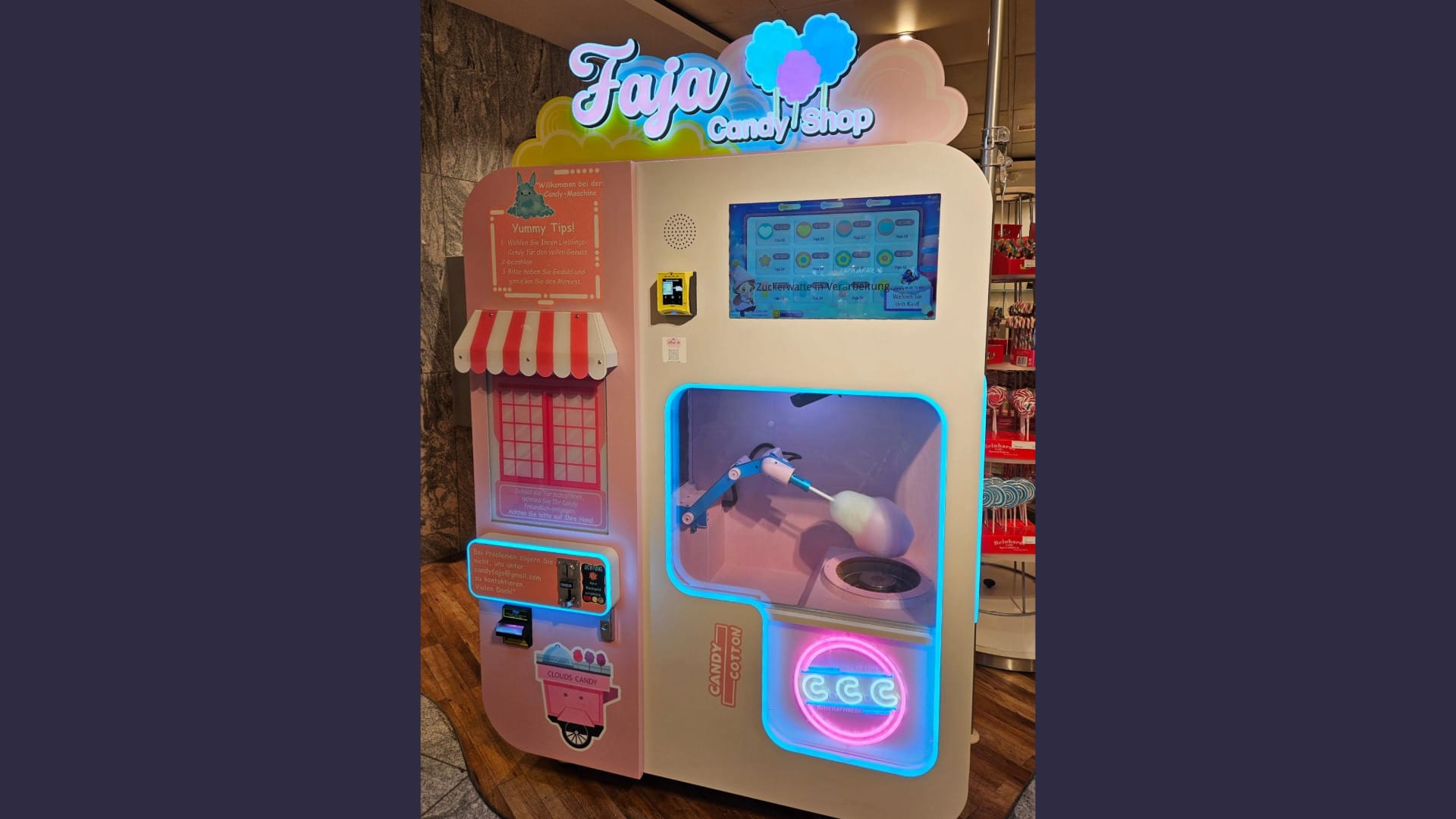Foto: Ein bunter Zuckerwatte-Automat steht in einem Kaufhaus